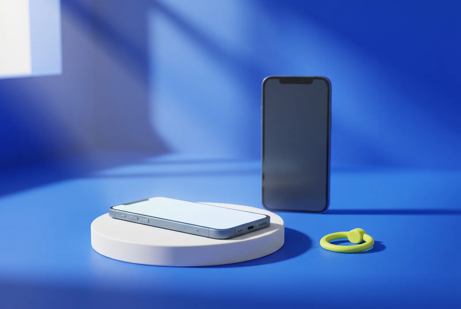 Two smartphones with blank screens and a lime grip ring on cobalt blue, a nod to how you can scan a QR code from a screenshot.