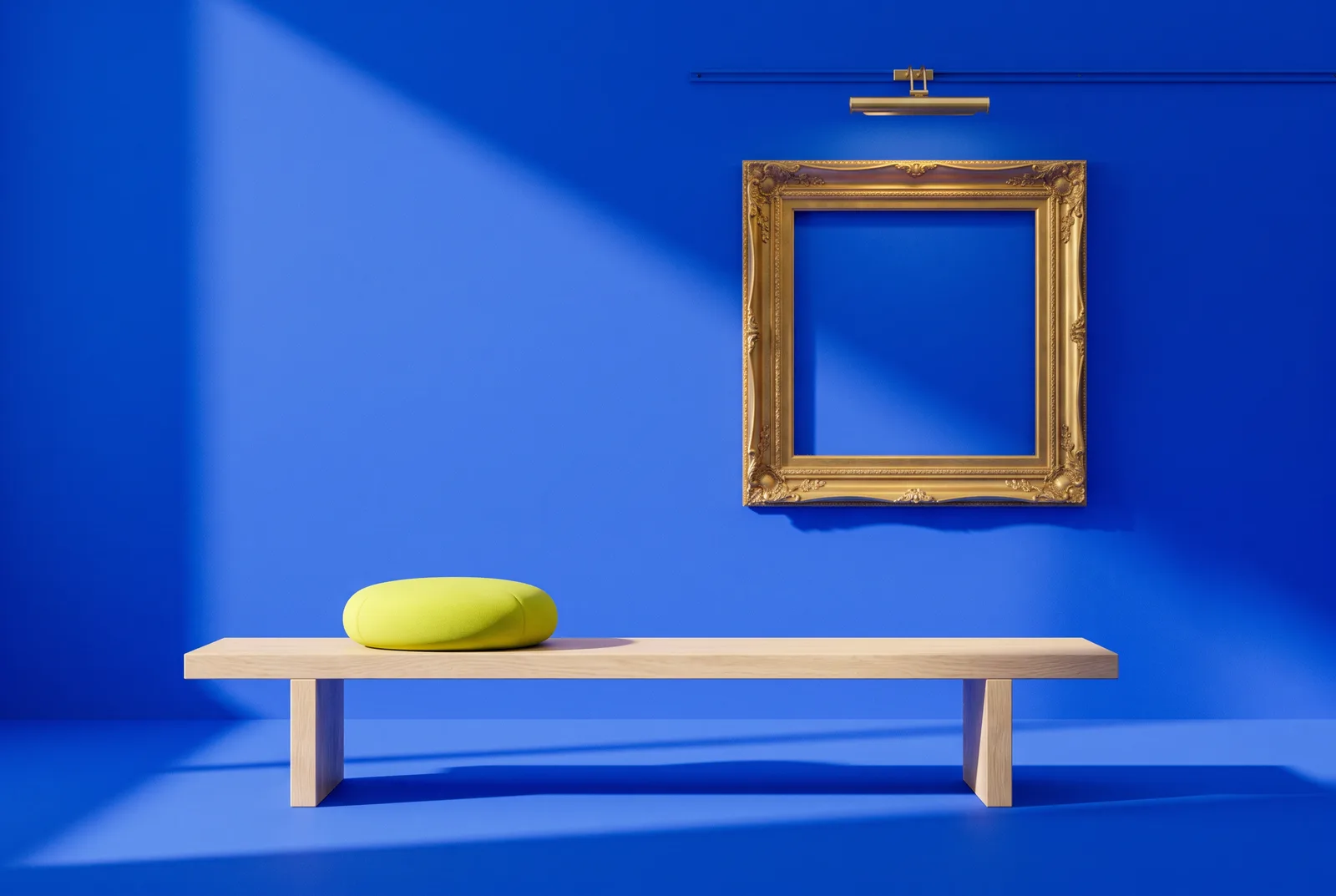 Famous paintings QR codes need a gallery: an empty gold frame under a brass spotlight above a pale oak bench with a lime cushion, on cobalt blue.
