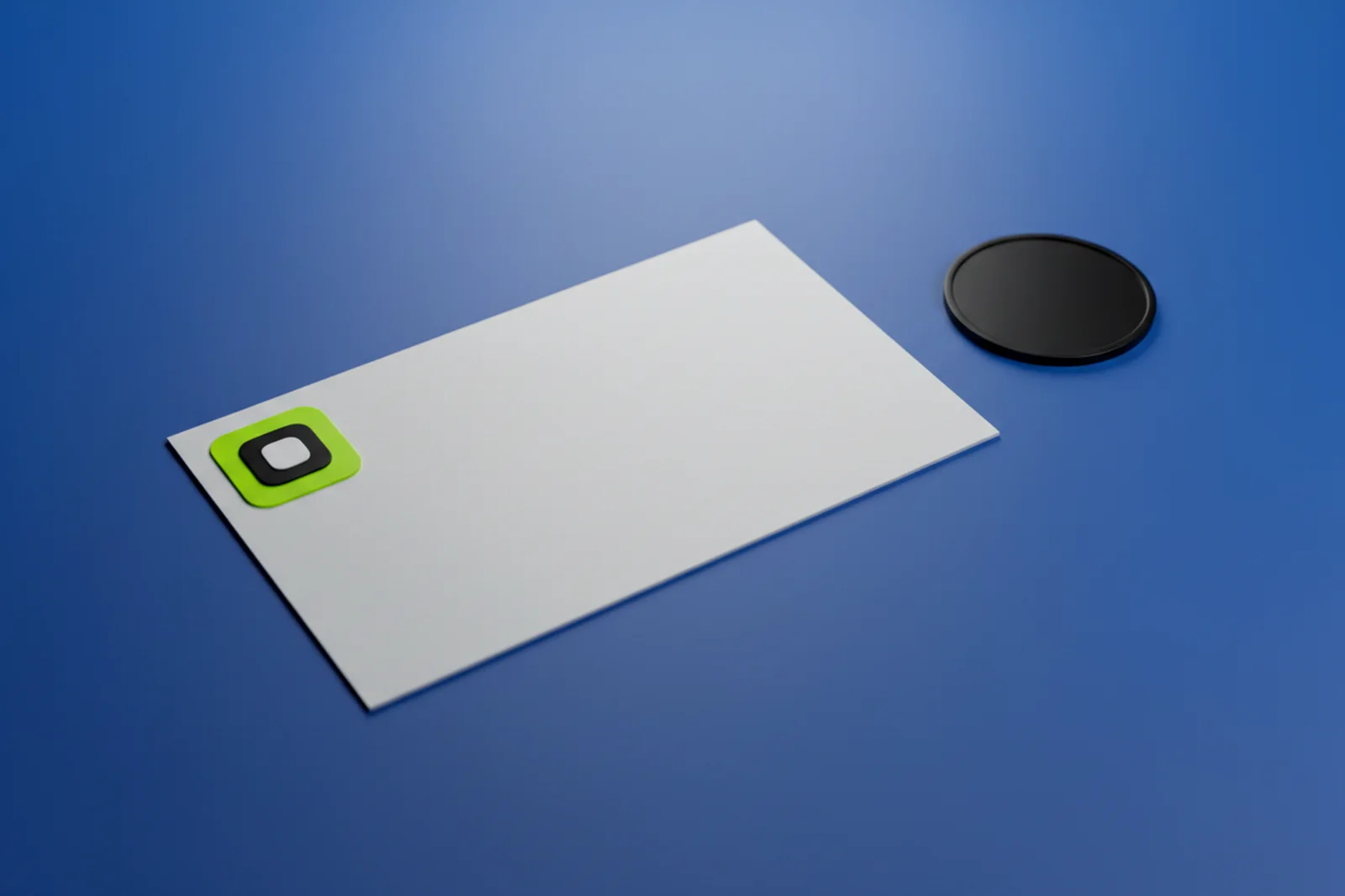 A stack of matte business cards on a desk, the top card showing a small AriaQR code built into a studio portrait, with a metal ruler beside it for scale.