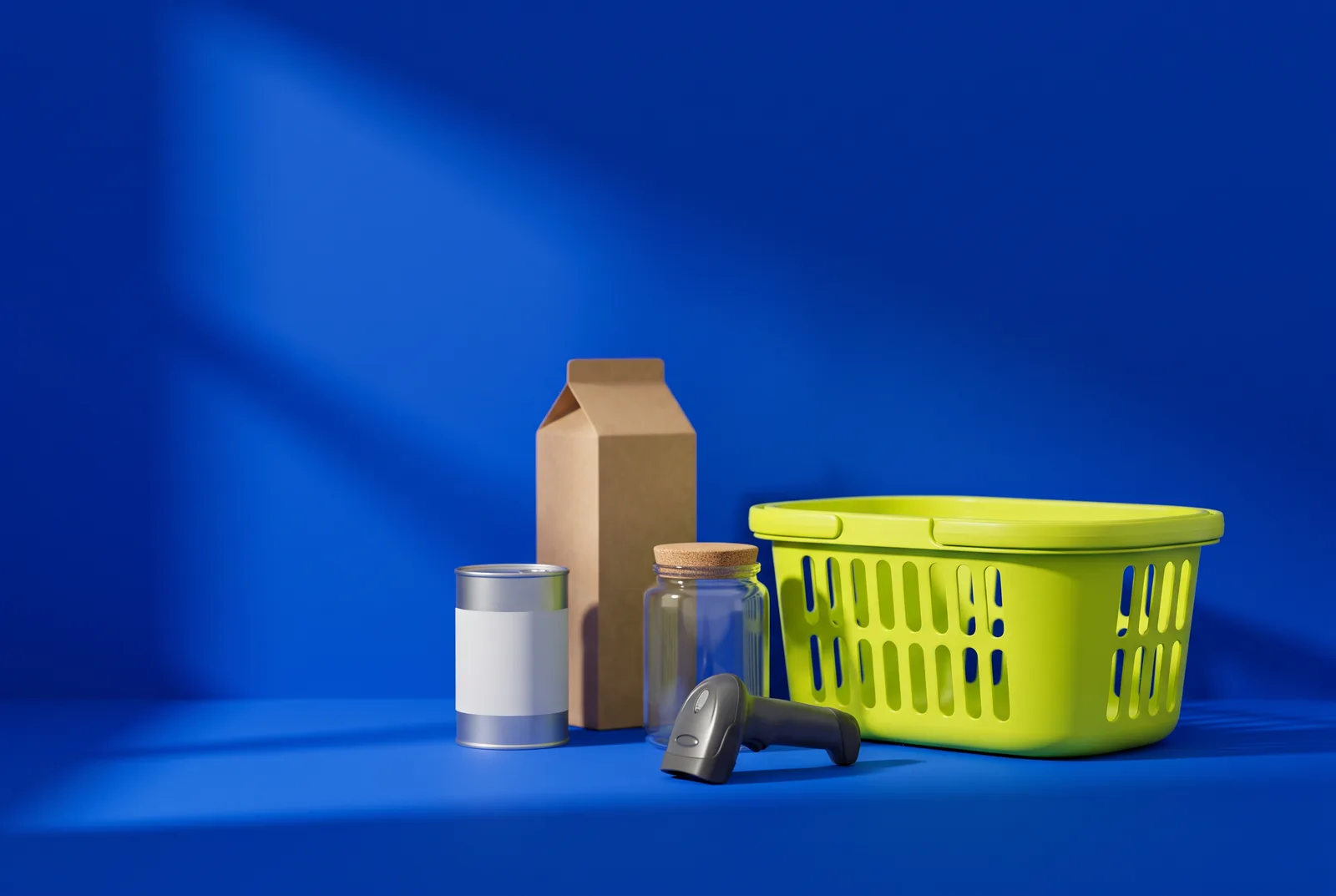 Will QR codes replace barcodes: a plain carton, a tin can, a glass jar and a handheld checkout scanner beside a lime shopping basket on a cobalt blue floor.